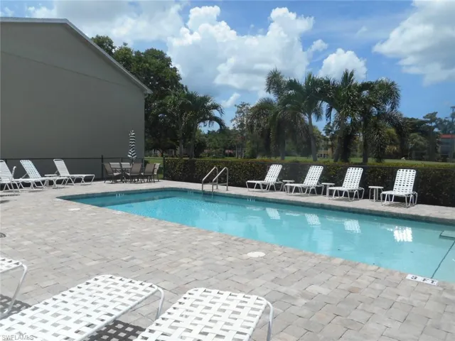 Community pool with a patio area