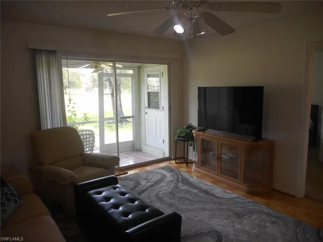 Living room featuring a ceiling fan