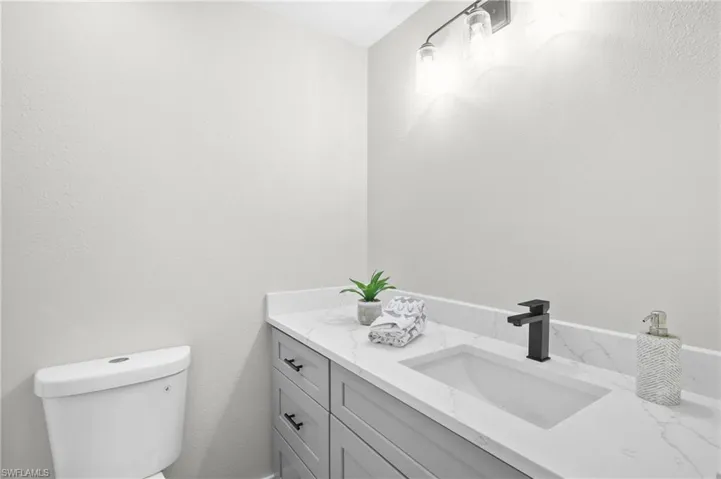 Bathroom with vanity and toilet