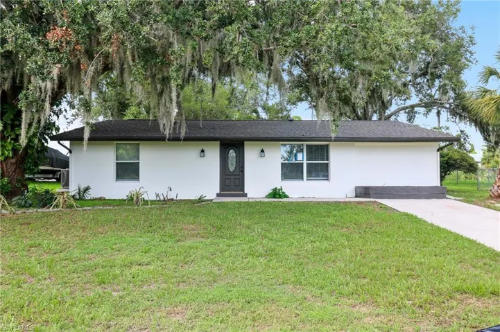 Single story home featuring a front yard