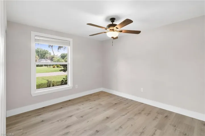 Spare room featuring light hardwood / wood-style flooring and ceiling fan