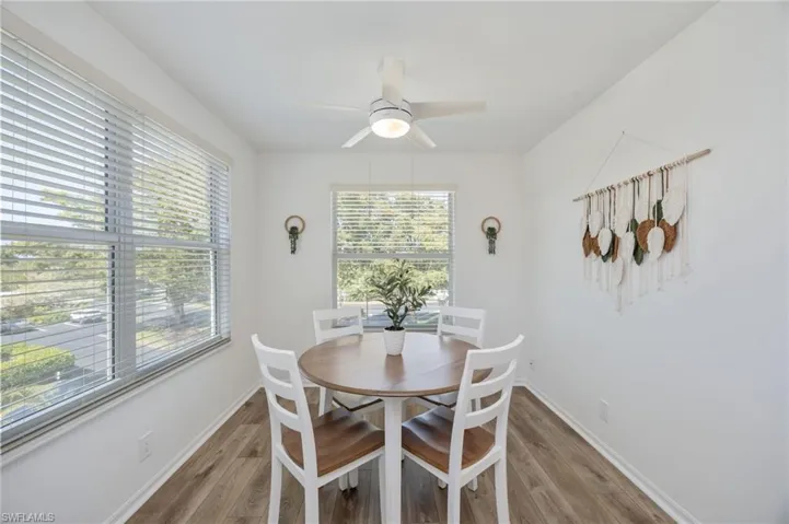 Dining space featuring a ceiling fan and light wood finished floors