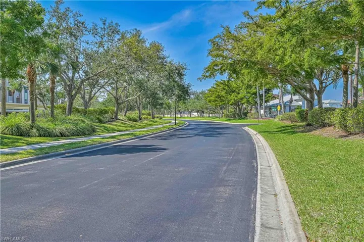 View of asphalt road with curbs