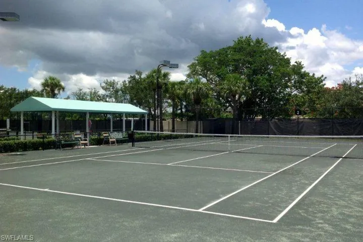 View of tennis court featuring community basketball court