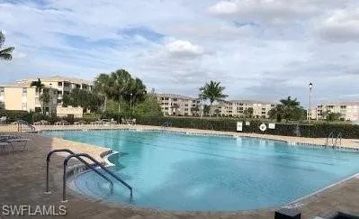 Community pool featuring a patio