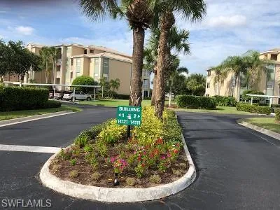 View of asphalt road with curbs and a residential view