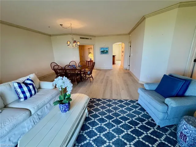 Wide open floor plan with new flooring throughout the condo.