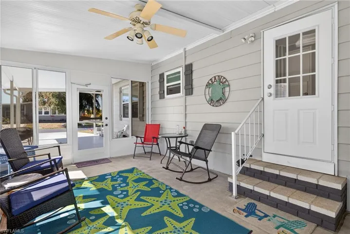 Sunroom / solarium with a ceiling fan
