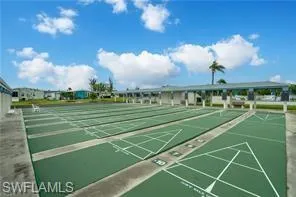 View of home's community with shuffleboard