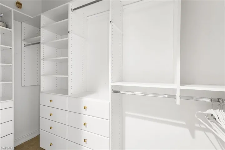 Primary closet is custom designed.