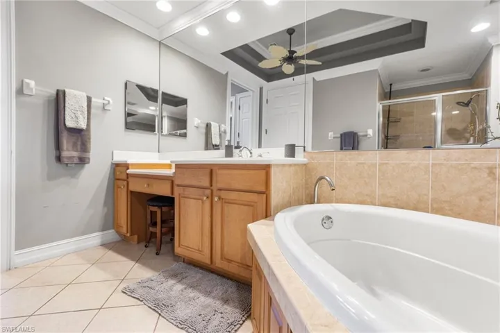 Ensuite primary bath has a spa like feeling with a separate soaking tub and walk in shower. Dual vanities and a dressing area.