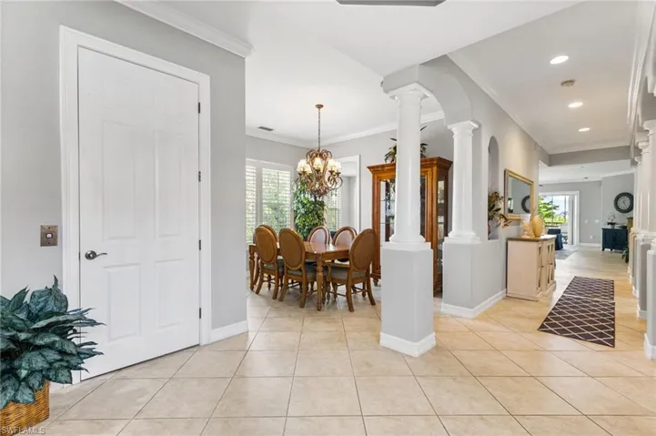 Formal dining room and offers entry from the kitchen which makes entertaining a breeze. Tile on the diagonal. Crown molding.