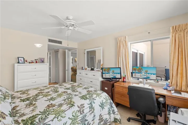 Bedroom featuring an office area and ceiling fan