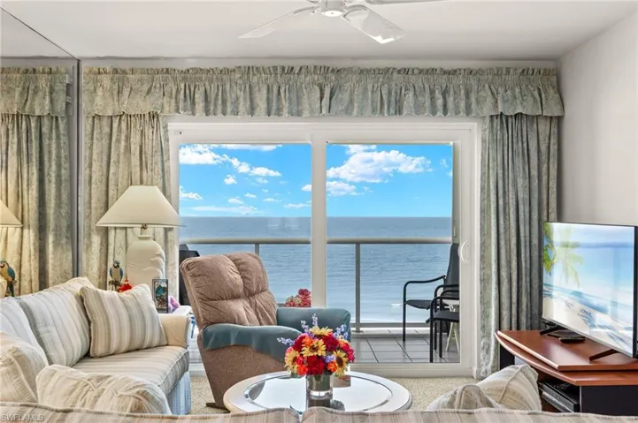Living room featuring a ceiling fan