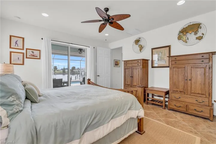 Bedroom with visible vents, ceiling fan, recessed lighting, and access to outside