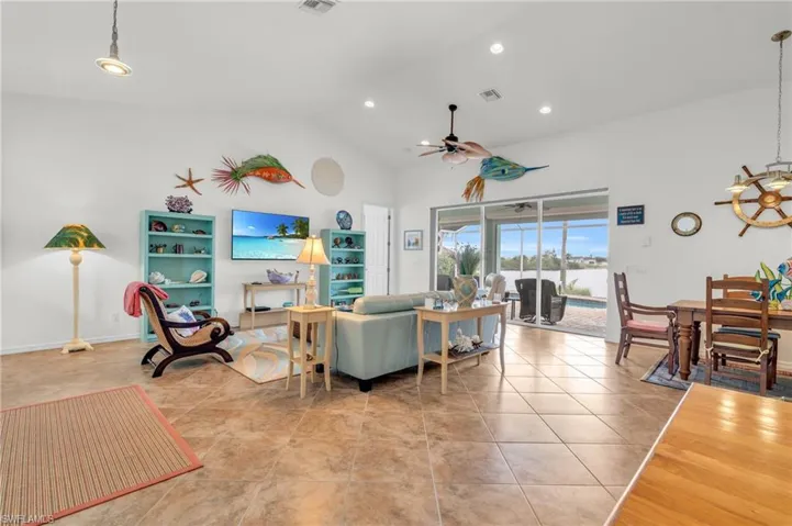 Living area featuring ceiling fan, visible vents, recessed lighting, and light tile patterned floors