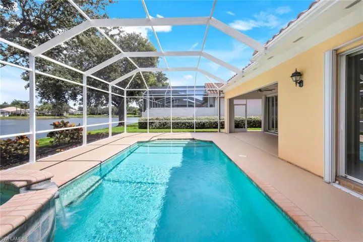 Swimming pool with a patio, a lanai, a sunroom, and ceiling fan