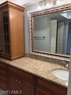 Full bath featuring vanity