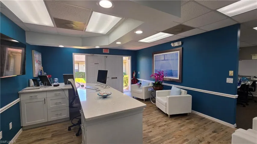 Office with a paneled ceiling