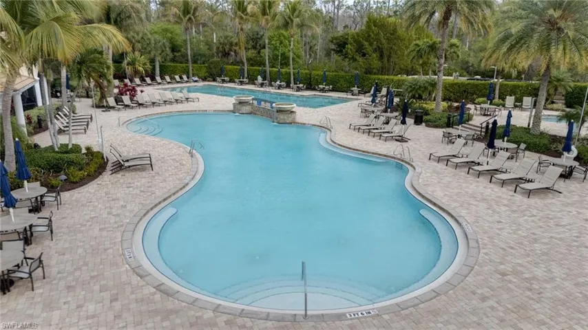 Community pool with a patio area