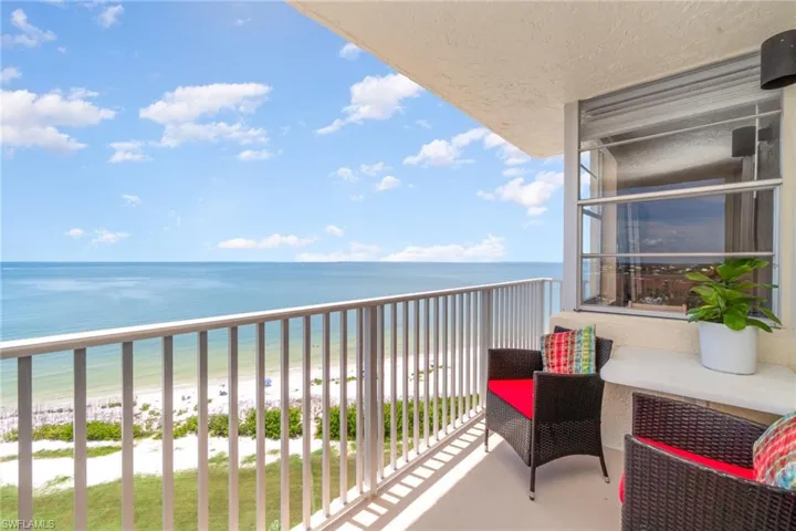 Balcony with a beach view and a water view