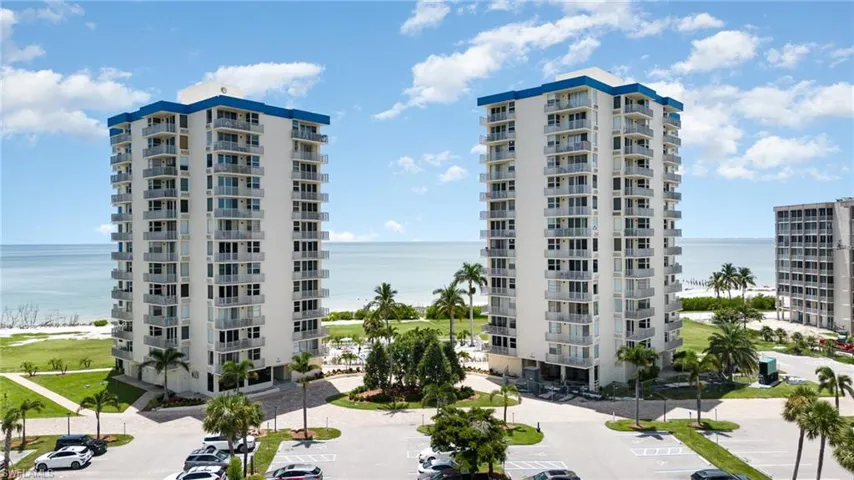 View of property with a water view