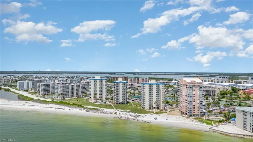 Drone / aerial view with a view of the beach and a water view