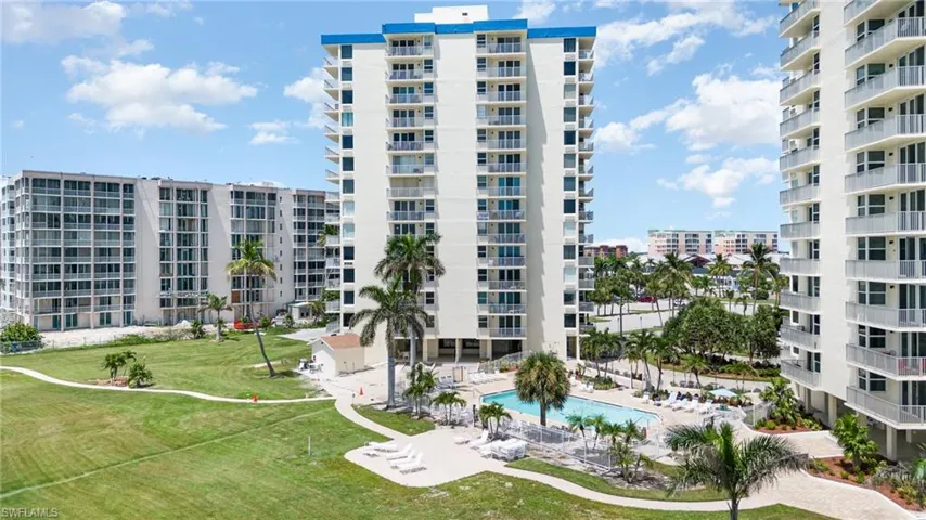 View of property with a community pool