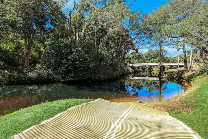 Dock featuring a water view and a boat ramp