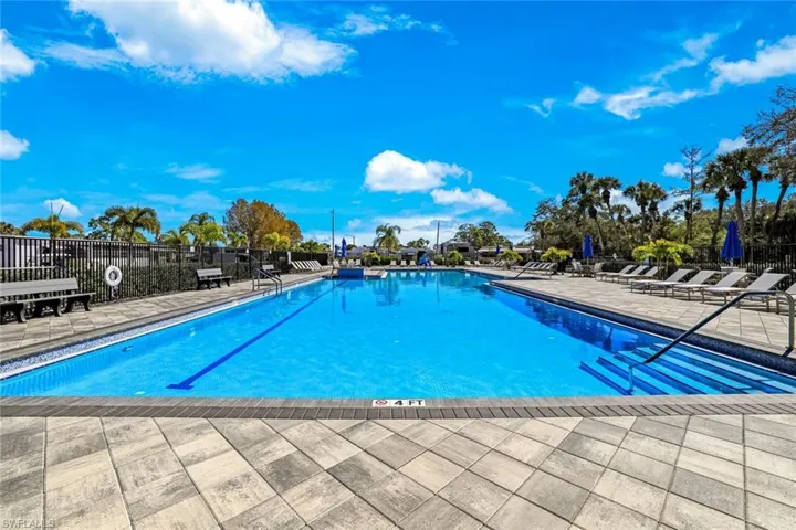 Community pool with a patio area
