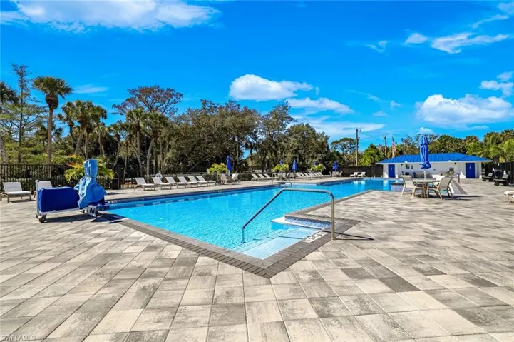 Community pool featuring a patio