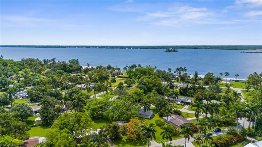 Aerial perspective of suburban area with a large body of water