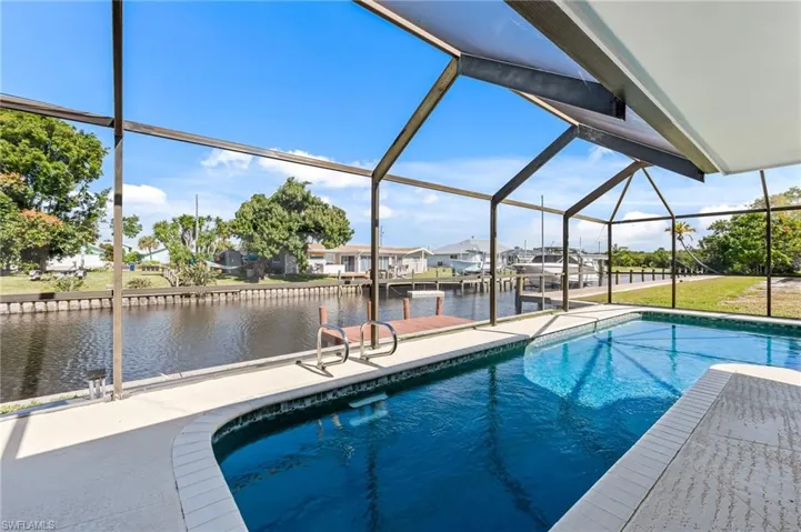 Screened outdoor pool area with direct canal access