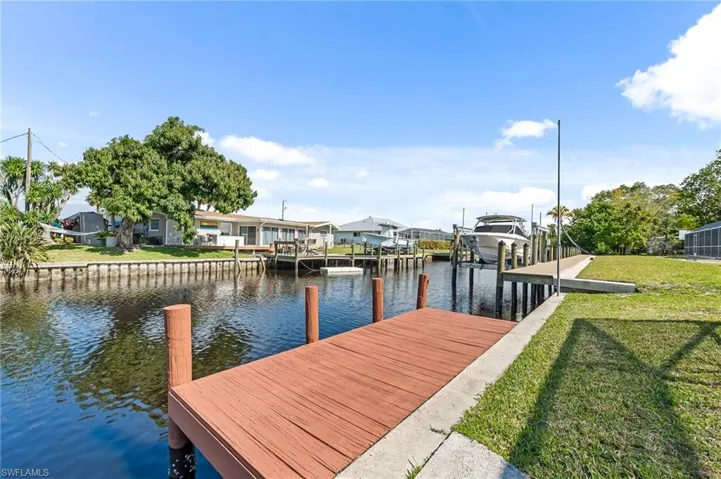 Waterfront property featuring a private dock and a boat lift