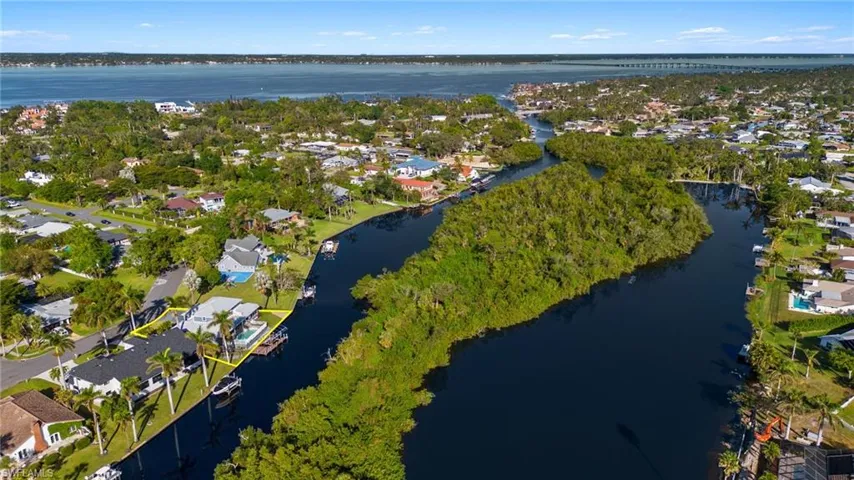 View of property location with nearby suburban area and a large body of water