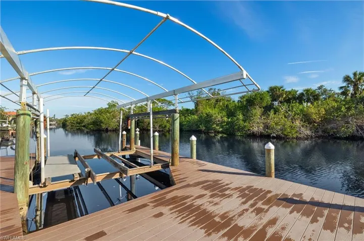 Dock with a water view and boat lift