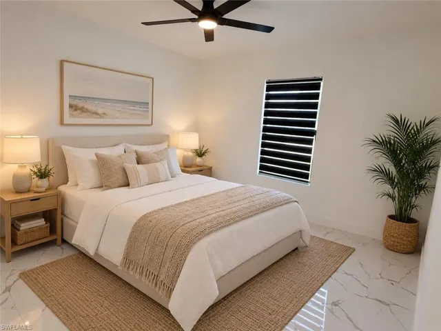 High vaulted ceiling, ceiling fan, solid surface flooring, integrated window shades, and a built-in headboard
