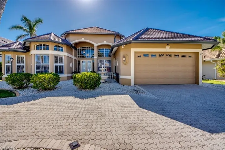 Mediterranean / spanish-style house featuring french doors and a garage