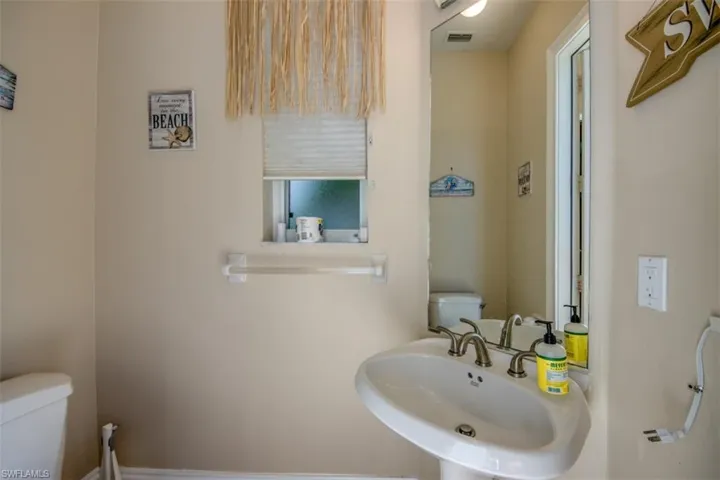 Bathroom featuring toilet and sink