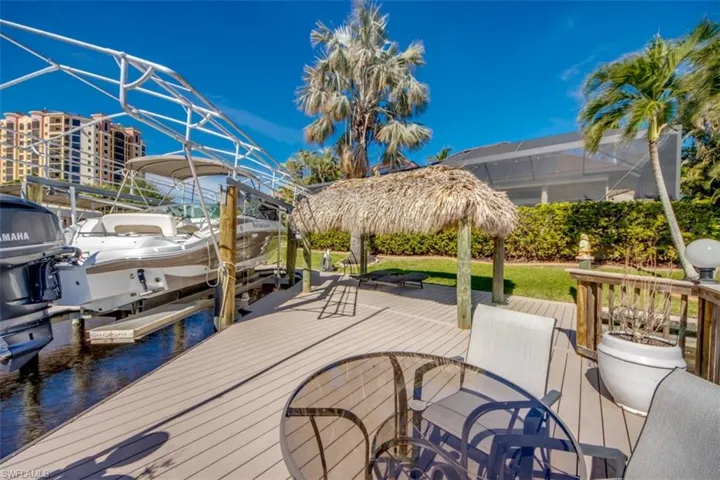 Dock area featuring a lanai and a water view