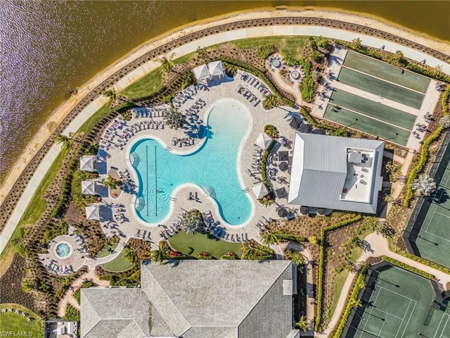 Drone / aerial view of a pool and a large body of water