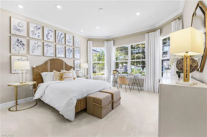 Bedroom featuring ornamental molding, light carpet, and recessed lighting