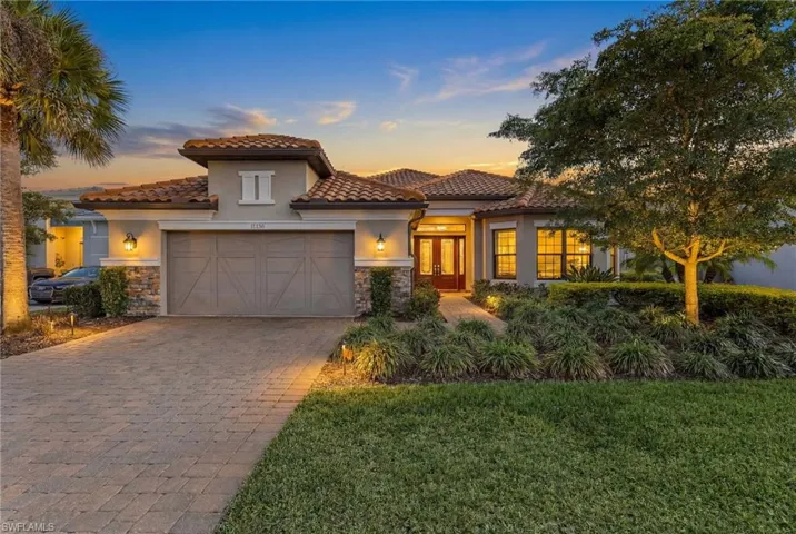 Mediterranean / spanish-style house with french doors, stone siding, stucco siding, and a tiled roof
