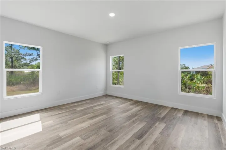 Unfurnished room featuring light wood-type flooring and recessed lighting