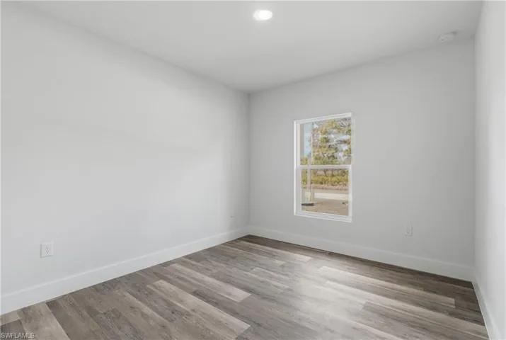 Unfurnished room featuring light wood-style floors and recessed lighting