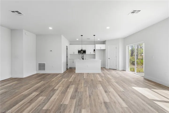 Unfurnished living room featuring recessed lighting and light wood finished floors