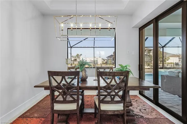 Dining space featuring a chandelier and plenty of natural light