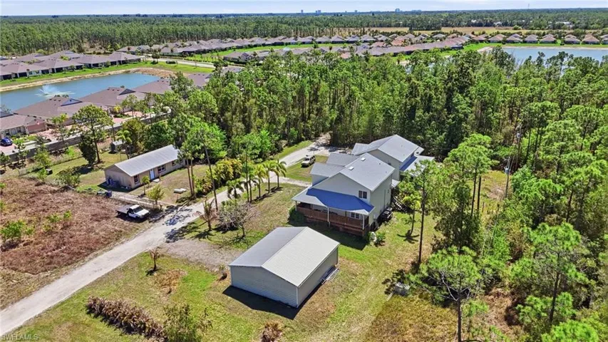 Aerial perspective of suburban area with a large body of water