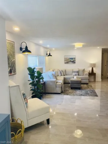Living room with light tile flooring