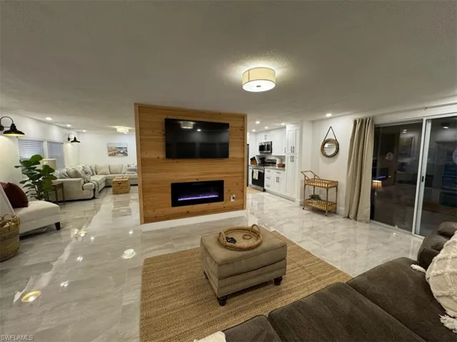 Tiled living room with a textured ceiling